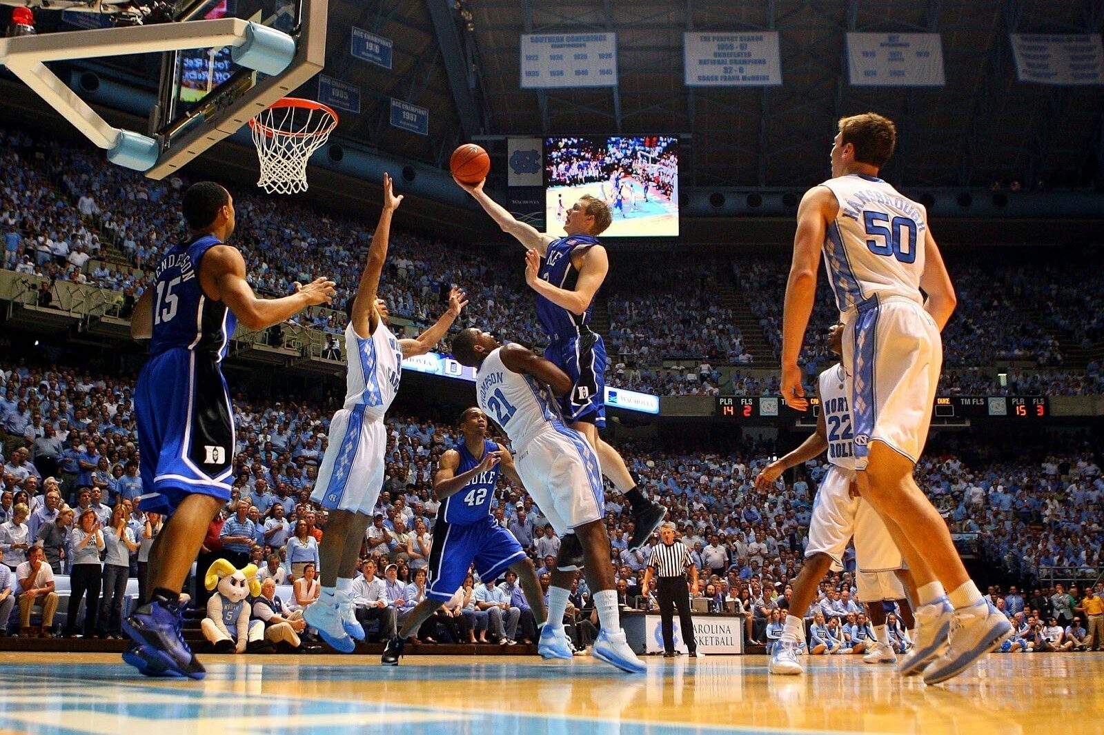 Basketball offense scene with players and ball in stadium