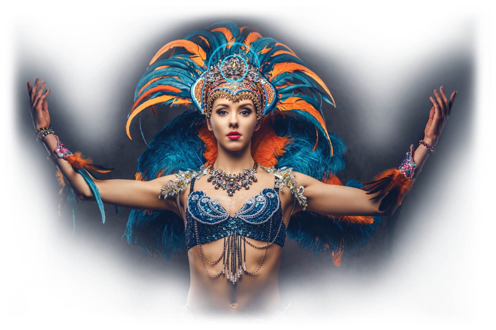 Studio portrait of a woman in a colourful carnival feathers