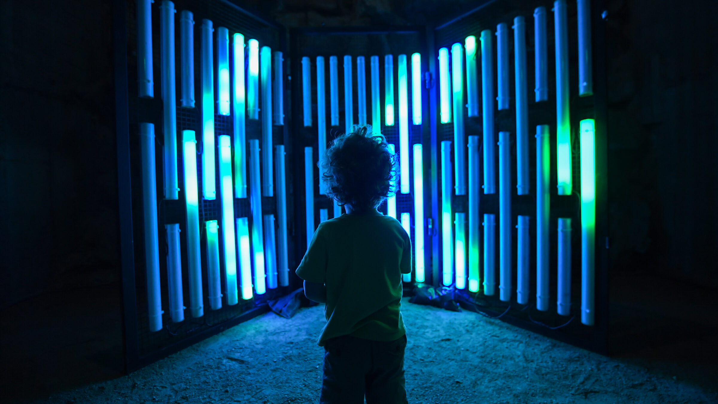 Child in front of light wall