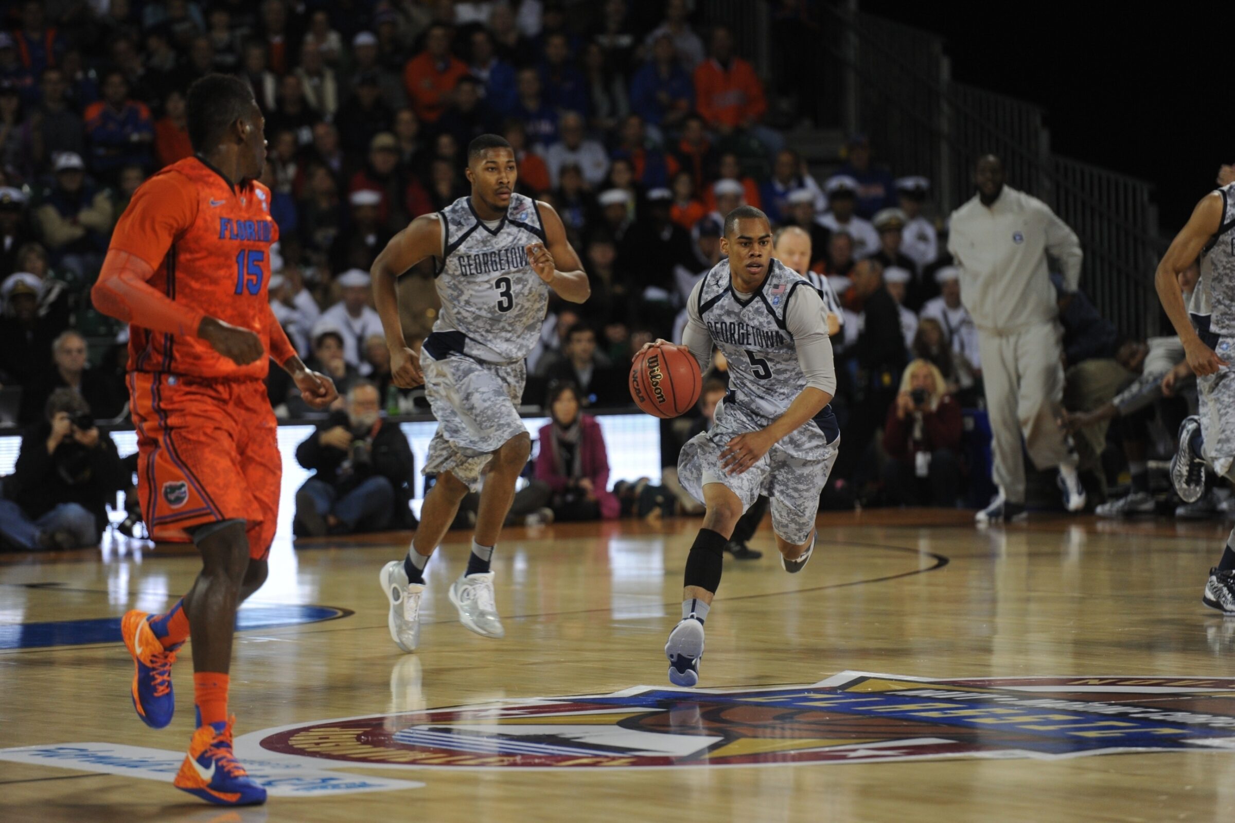 Basketball gameplay with players in stadium