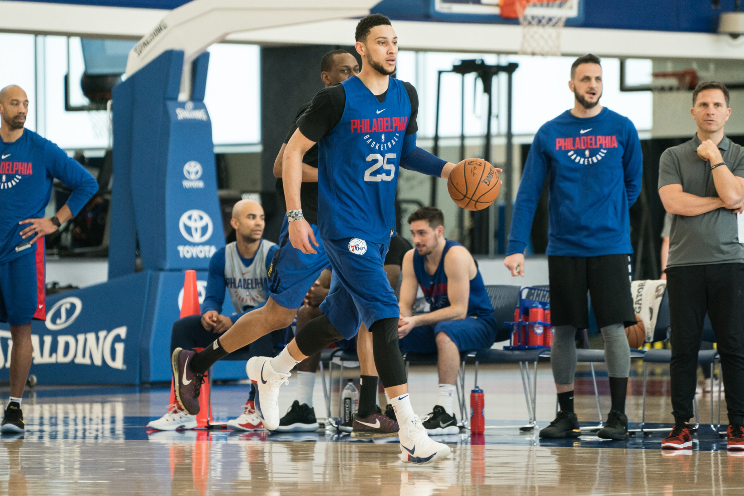 Basketball training scene blue player with ball