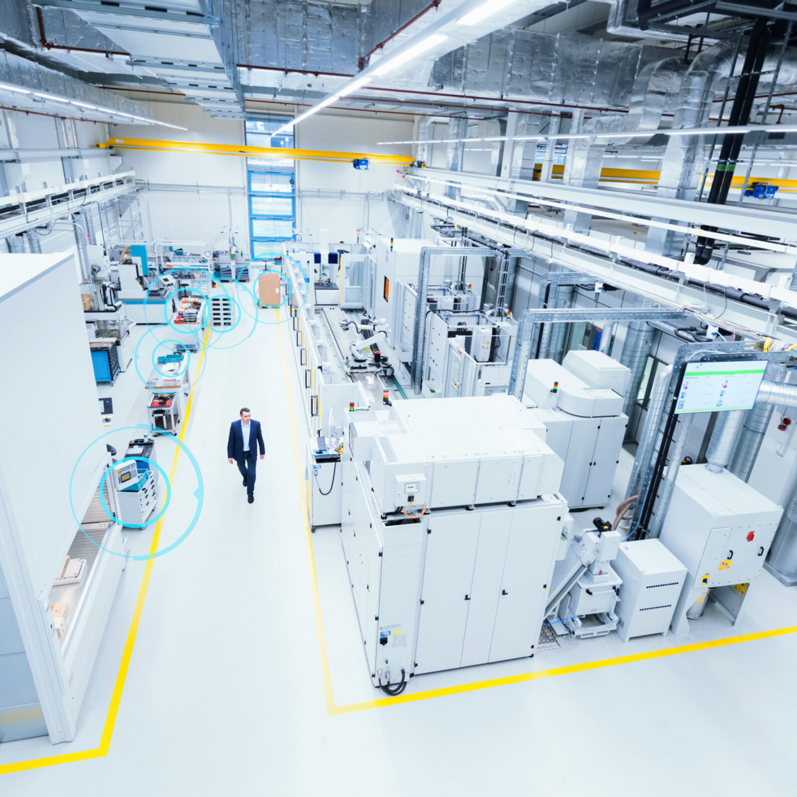 man walking through factory floor