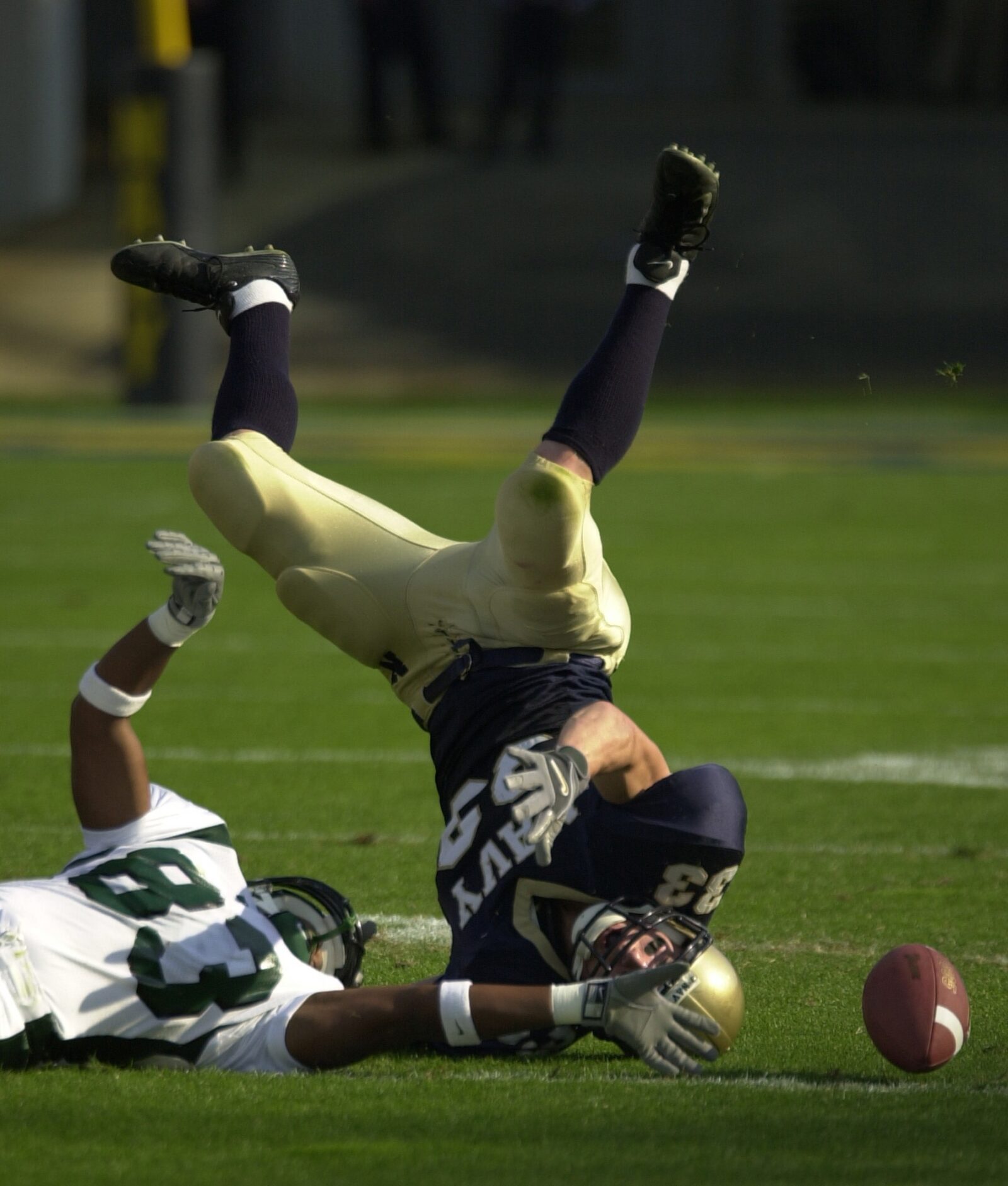 A linebacker lands on his head while attempting catch the ball, which is one of the reasons more coaches are using sports data to help prevent recurring injuries like concussion.