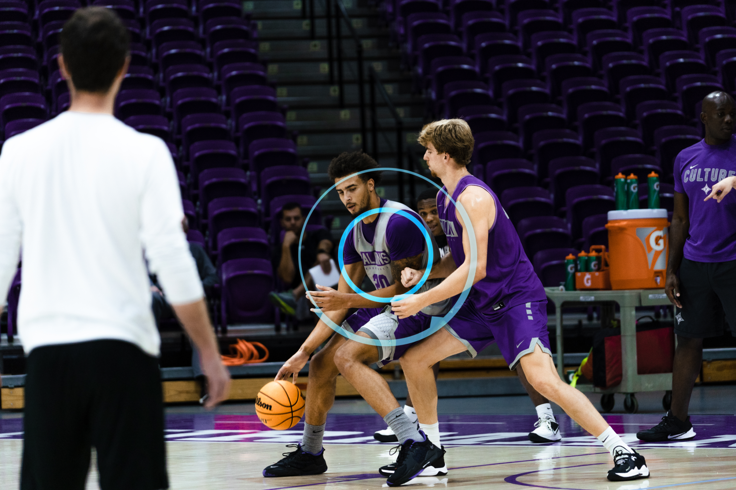 A basketball team uses LPS and IMU player tracking devices to gather basketball analytics.