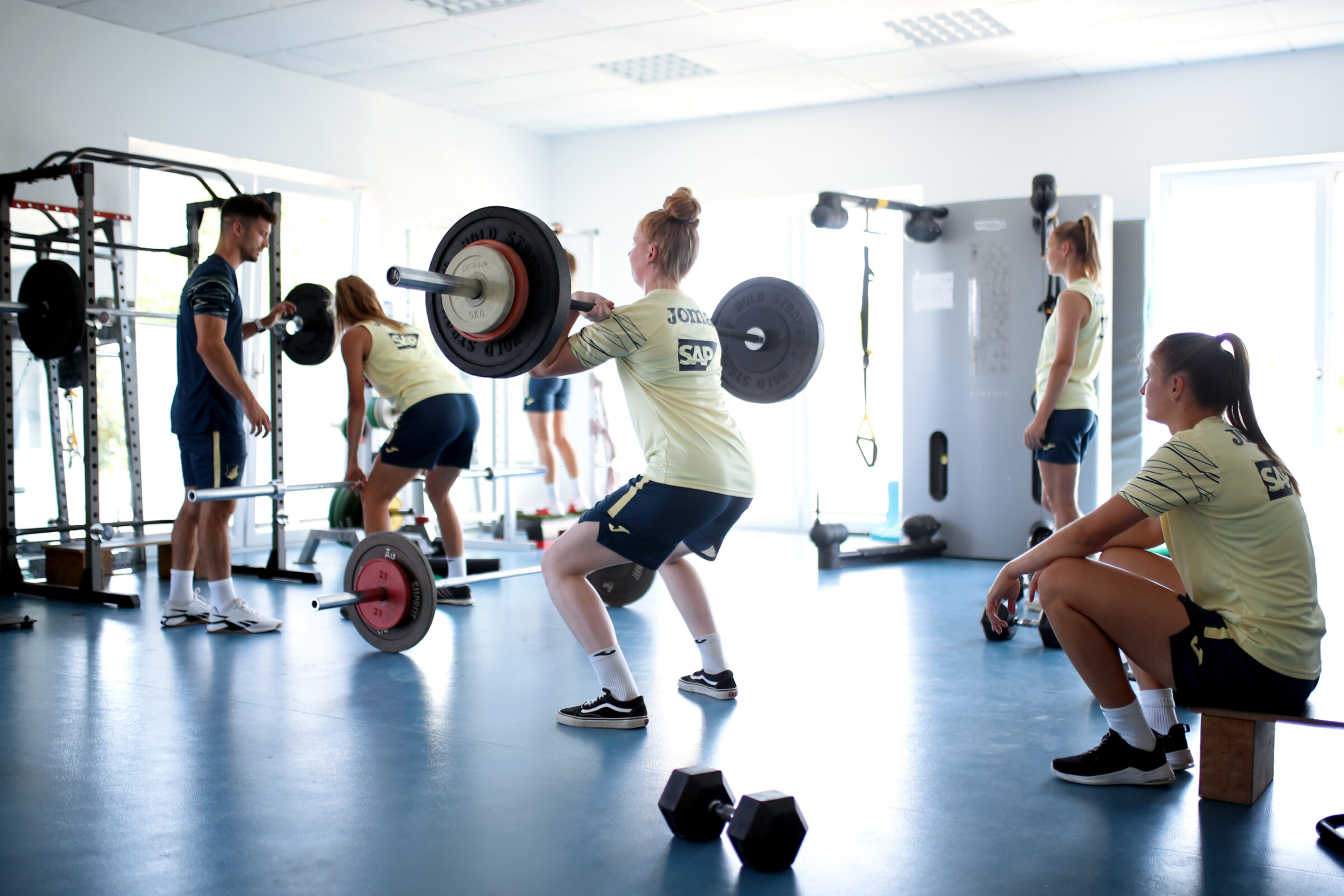 The female athletes from the Hoffenheim Football team training in the gym.