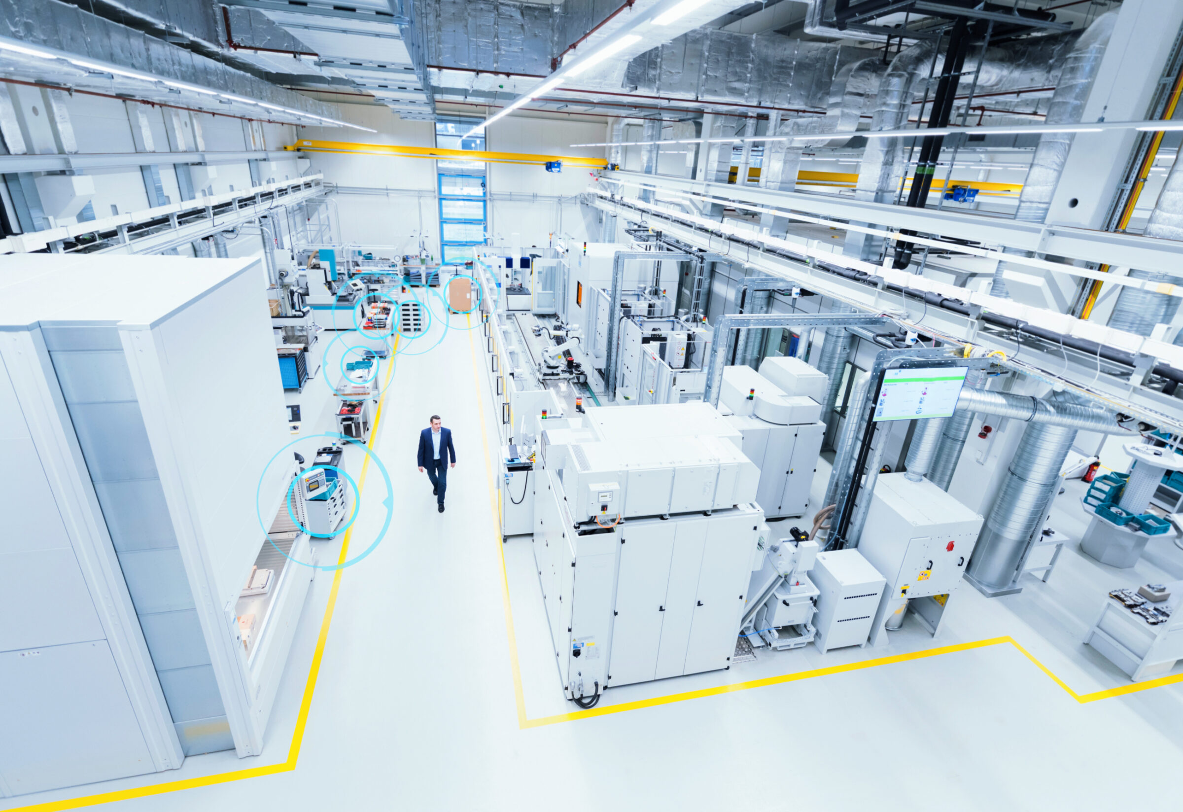 man walking through factory floor