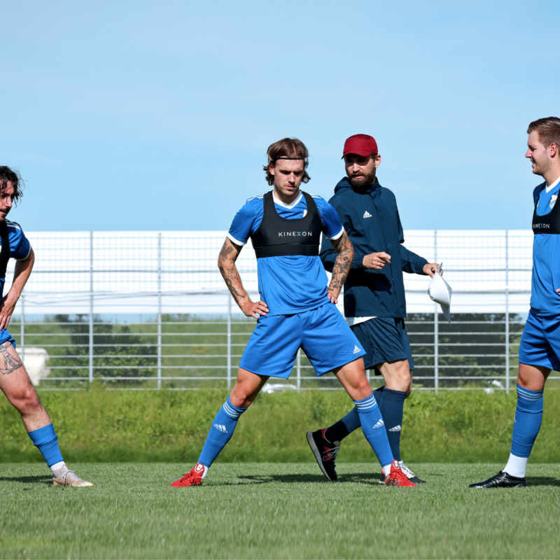 A soccer vest is worn by players in many sports, either above or underneath their playing or practice jersey.