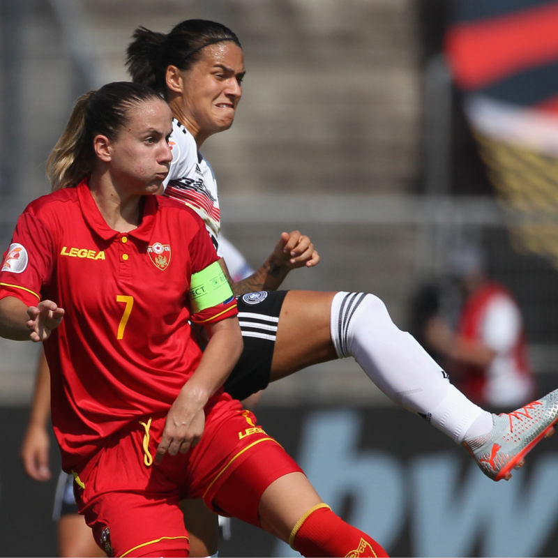 Dzsenifer Marozsan of Germany challenges Sladana Bulatovic of Montenegro during the Women's EM Qualification match between Germany and Montenegro